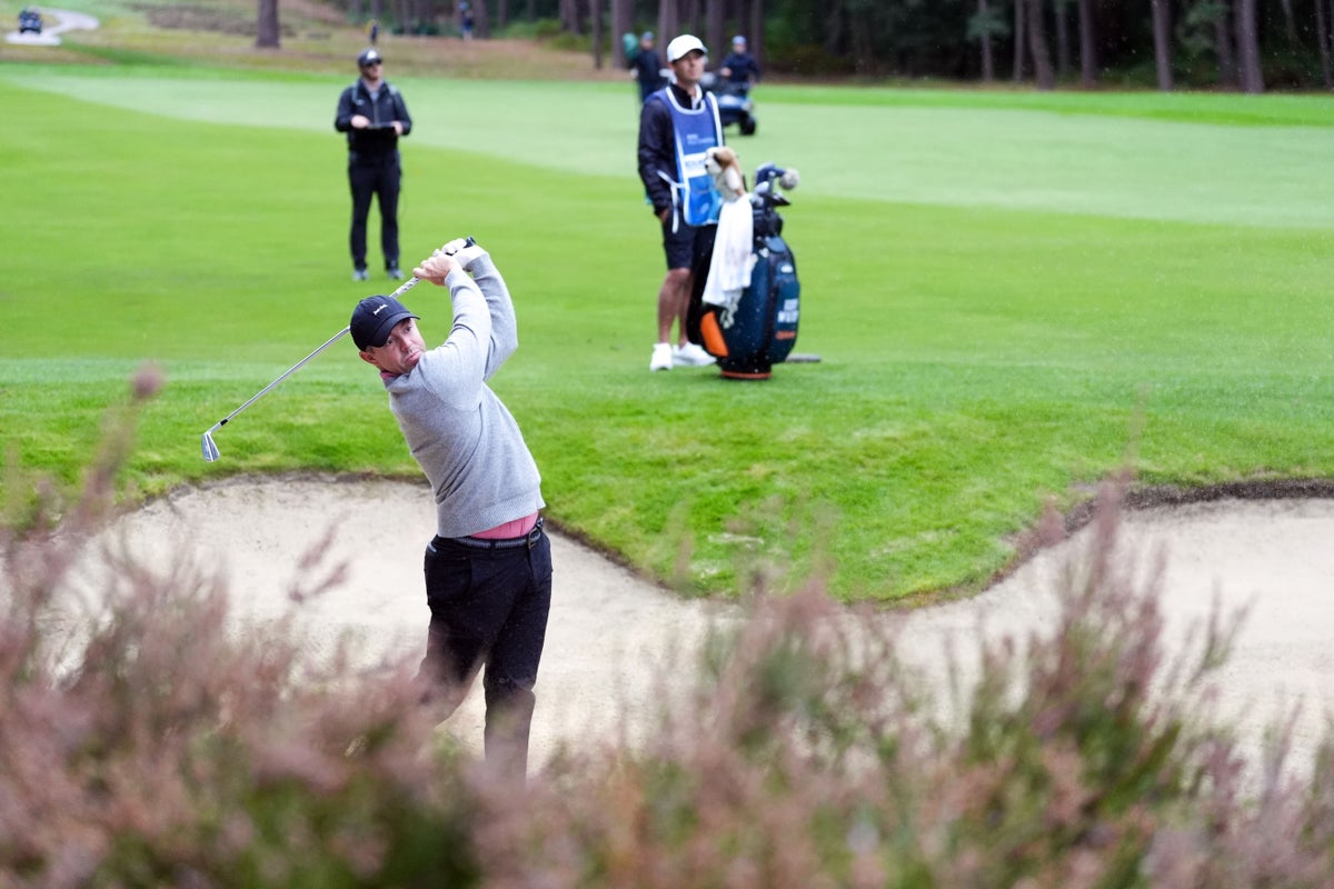 Rory McIlroy falters after strong start as Aaron Rai leads at Wentworth